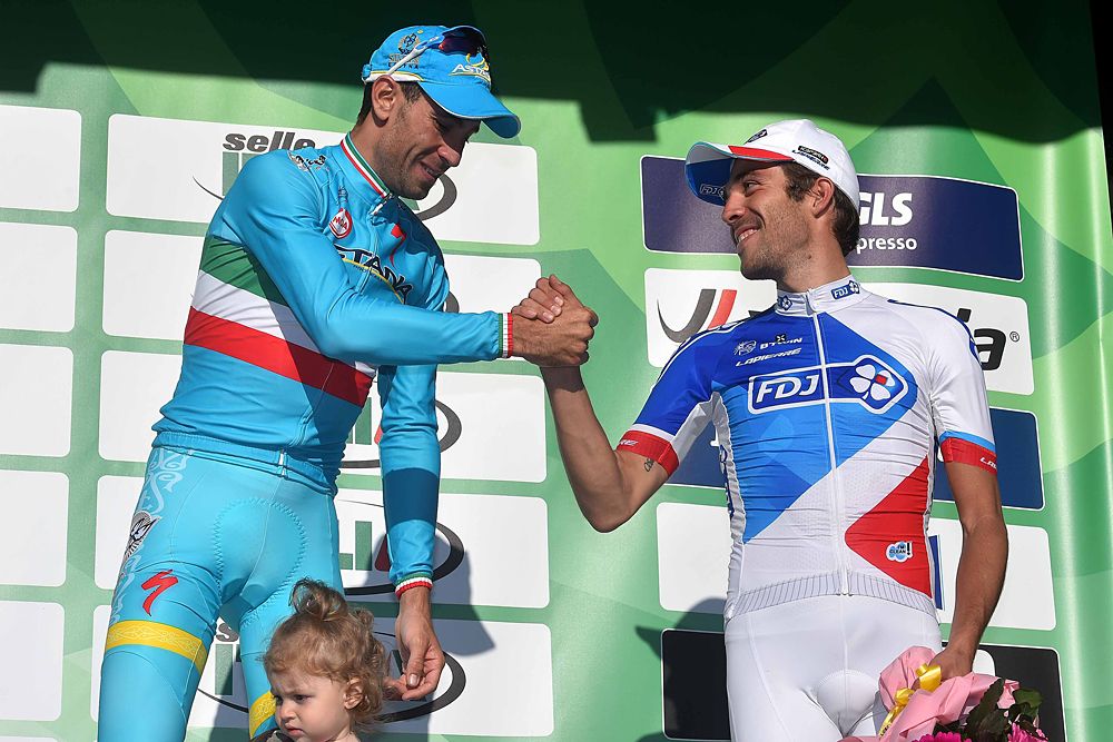 Vincenzo Nibali (Astana) and Thibaut Pinot (FDJ) shake hands on the podium