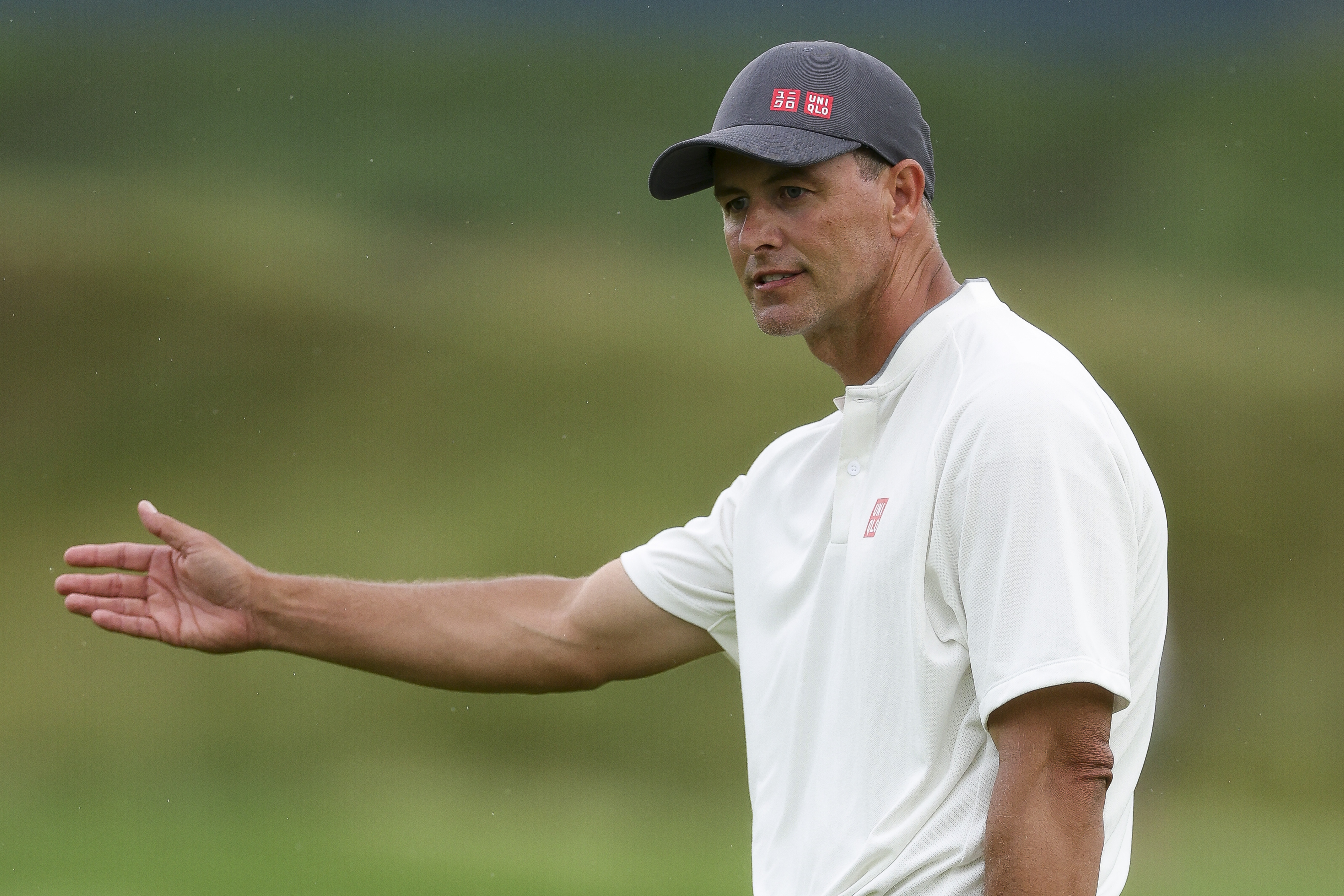 Adam Scott points right