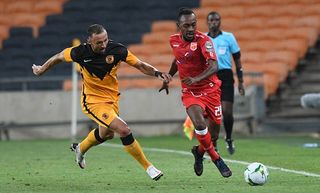 Mohamed Amadou Djibo of Horoya AC challenged by Samir Nurkovic of Kaizer Chiefs 