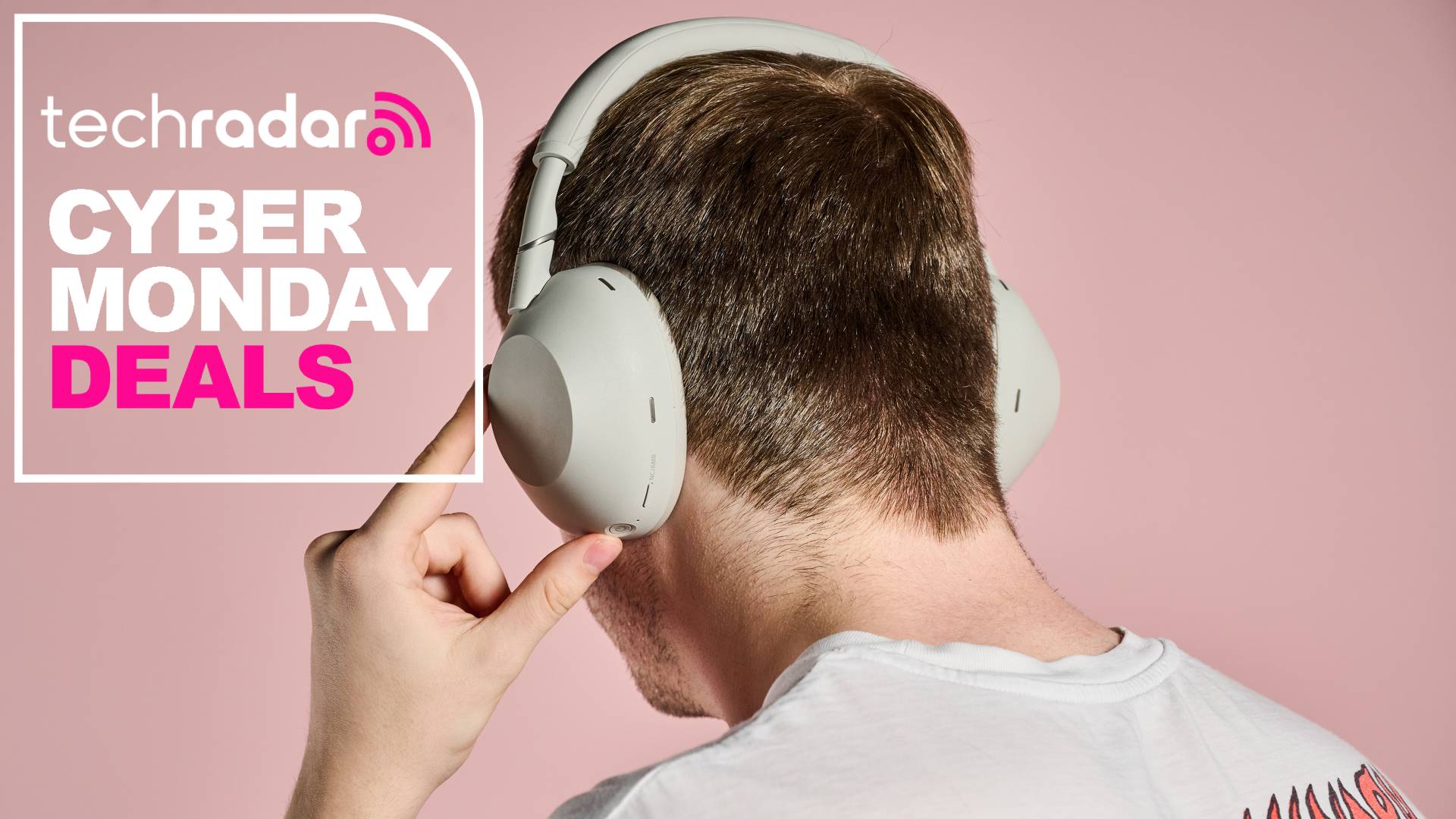 Man turning on Sony WH-1000XM6 headphones while wearing them, with words 'TechRadar: Black Friday deals' positioned on left side of the screen