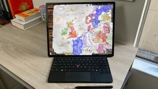 Lenovo ThinkPad X1 Fold 16 review unit on desk playing Crusader Kings 3
