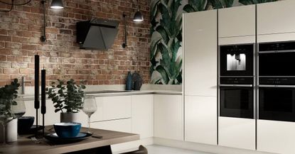 A modern kitchen with white units and cupboards with built in appliances. 
