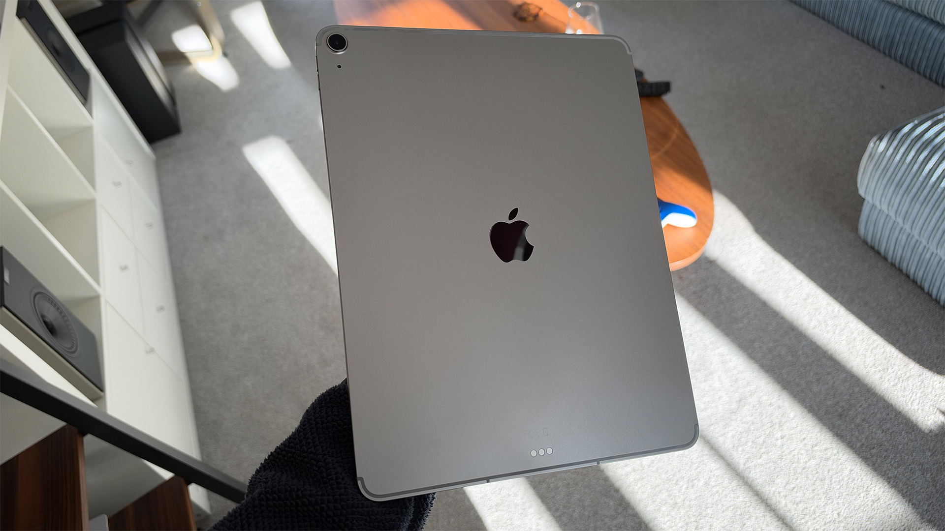 Apple iPad Air 13-inch (M4) tablet held in hand showing rear of tablet