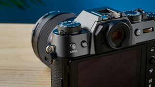 A Fujifilm X-T50 camera in the charcoal grey colorway