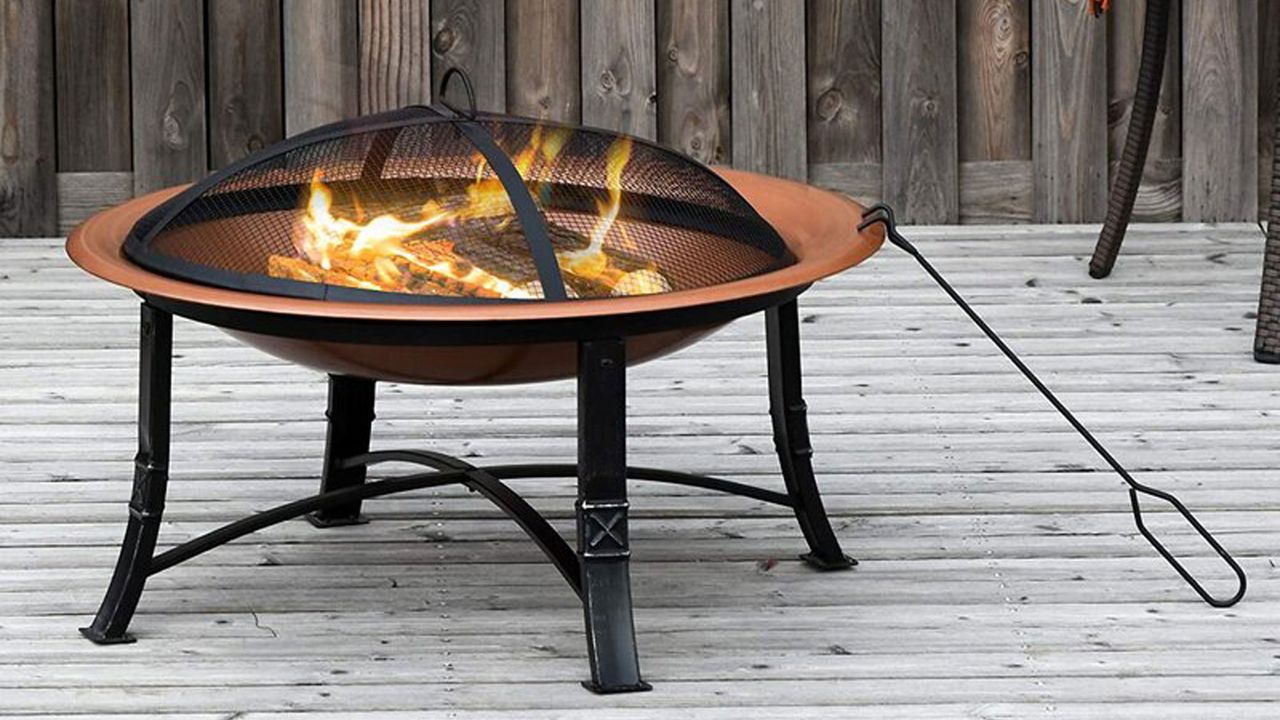 HOMCOM Wayfair fire pit in garden on decking