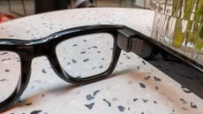 Meta Ray-Ban Display smart glasses sitting on coffee table