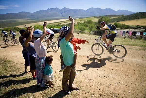 Specators cheer on racers.