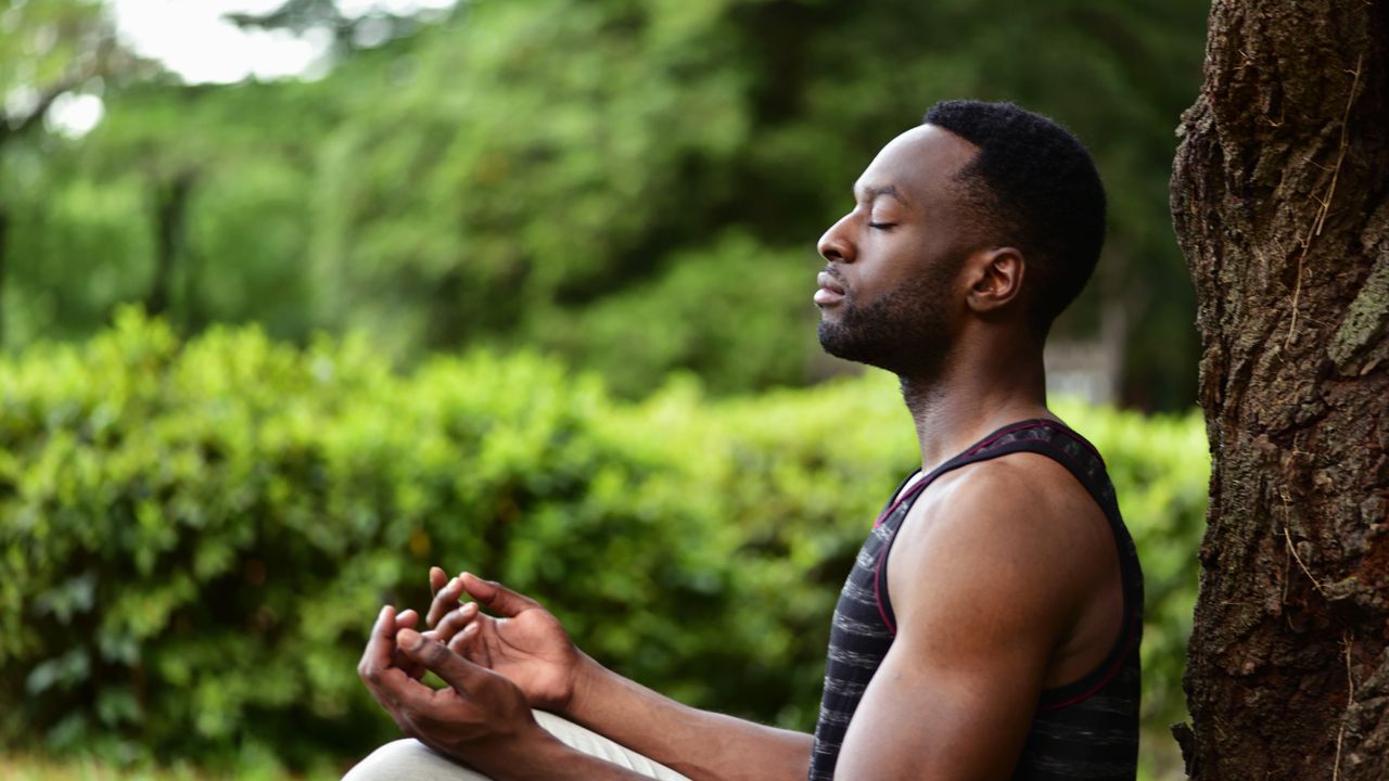 Man meditating outside