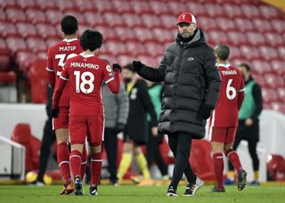 Liverpool manager Jurgen Klopp and Takumi Minamino