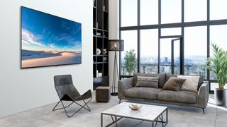 LG QNED MiniLED 99 Series 8K TV hanging on wall in living room