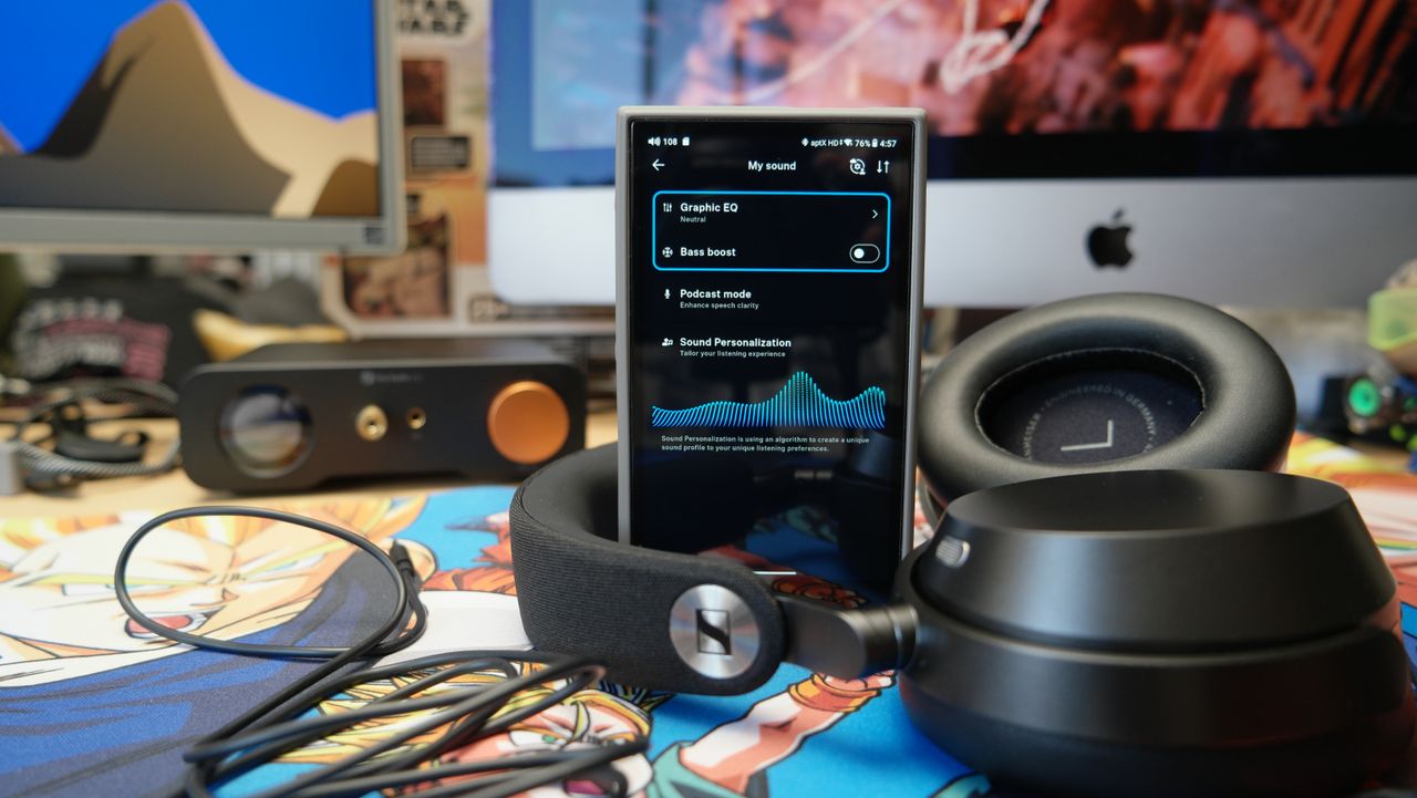 Sennheiser Momentum 5 headphones on a desk with a FiiO M21 DAP