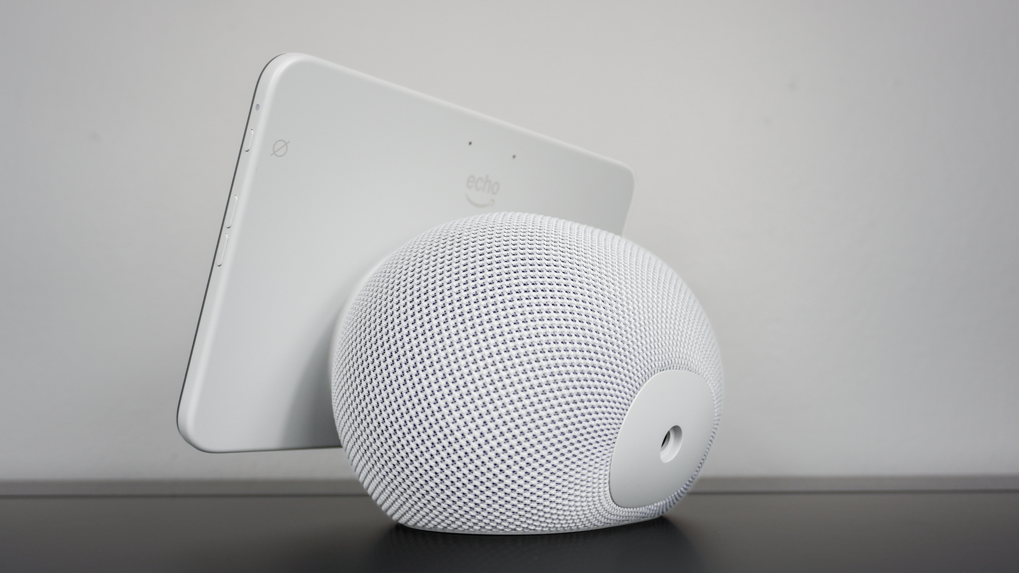 An angled view of the Echo Show 8 (4th Gen) showing the icon for the mute button