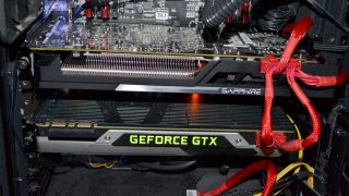 That's a Sapphire R9 390 sitting above a GTX 980. Prepare for the coming apocalypse!