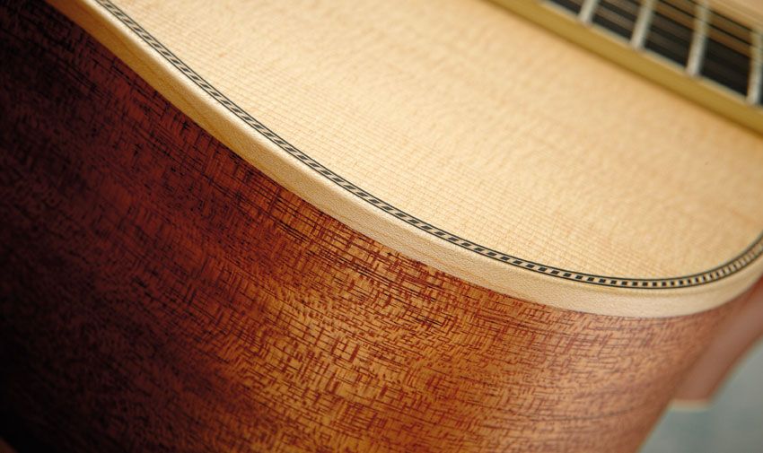 The OM-40 features mahogany back and sides and solid maple binding