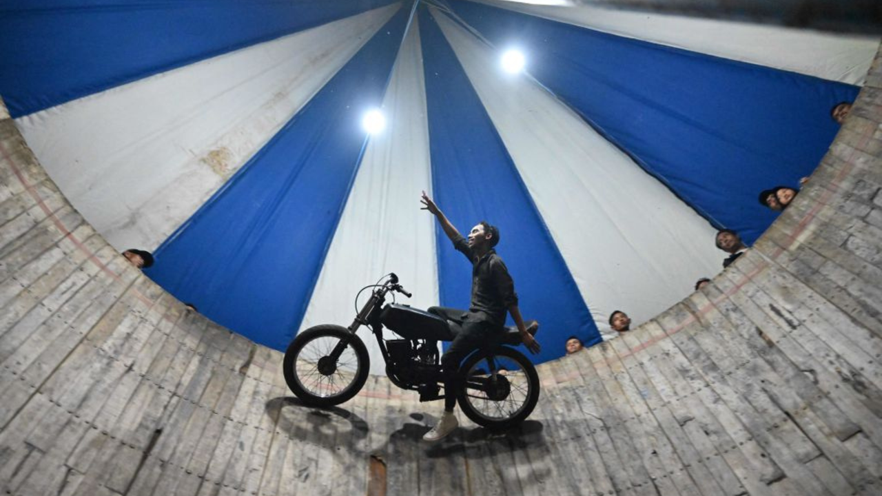 A motorcyclist completes a Wall of Death