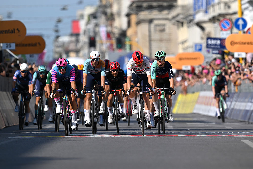 MILAN, ITALY - MAY 24: (L-R) Dylan Groenewegen of Netherlands and Team Unibet Rose Rockets, Ethan Vernon of Great Britain and Team NSN Cycling, Paul Magnier of France and Team Soudal Quick-Step and Tobias Lund Andresen of Denmark and Team Decathlon CMA CGM cross the finish line during the 109th Giro d&amp;amp;apos;Italia 2026, Stage 15 a 157km stage from Voghera to Milan / #UCIWT / on May 24, 2026 in Milan, Italy. (Photo by Tim de Waele/Getty Images)