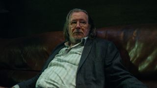 Gary Oldman sitting slouched in a chair in Slow Horses season 4