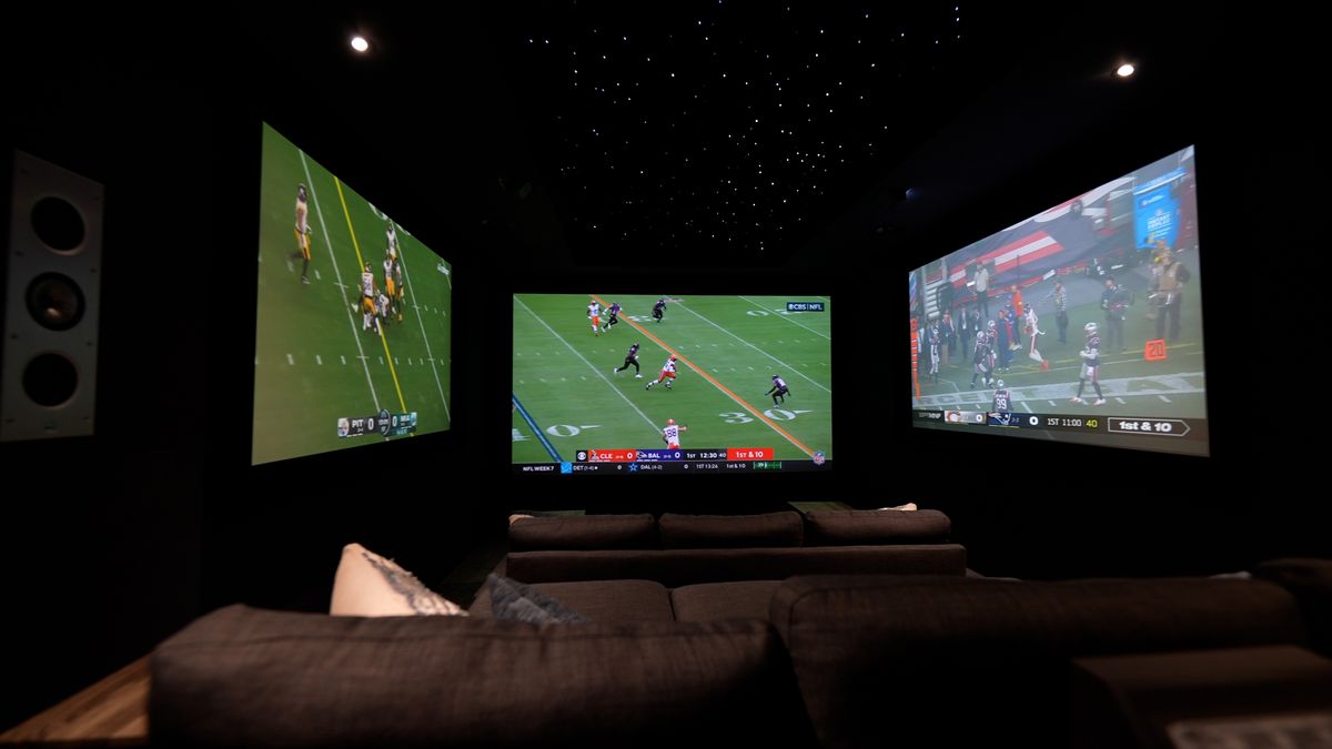 images of The Ultimate Home Theater Gaming Setup theater showing three projection screens, sofas and gaming peripherals