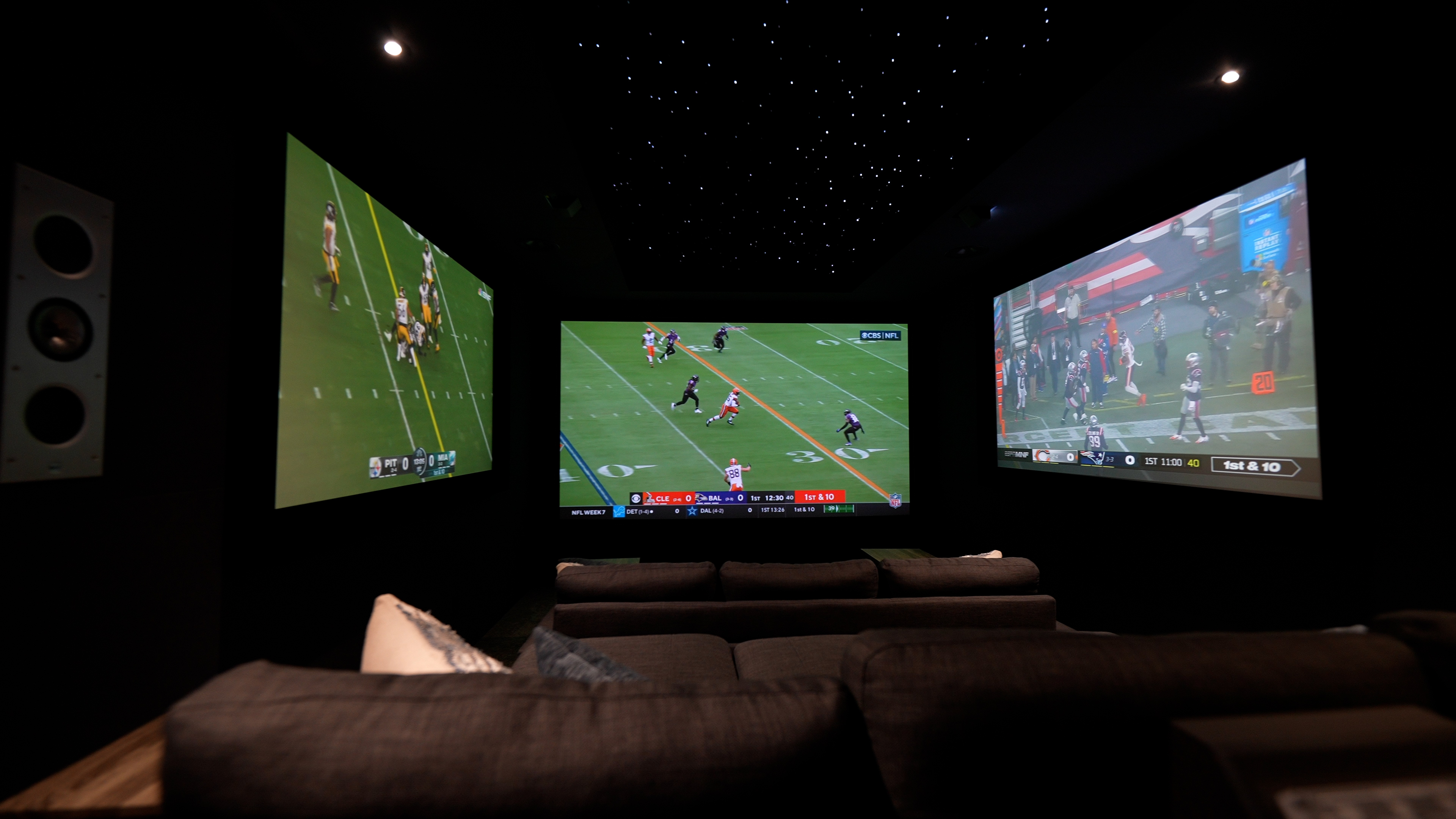 images of The Ultimate Home Theater Gaming Setup theater showing three projection screens, sofas and gaming peripherals
