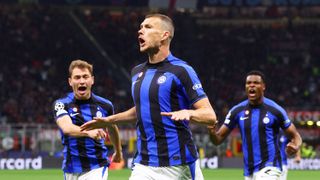 Edin Dzeko of FC Internazionale celebrates with teammates after scoring the team's first goal during the UEFA Champions League semi-final