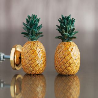 A pair of pineapple shaped door knobs