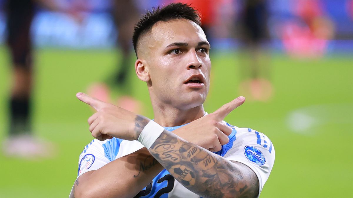 Argentina&#039;s Lautaro Martinez crosses his arms across his chest celebrating a goal against Peru at Copa America 2024.