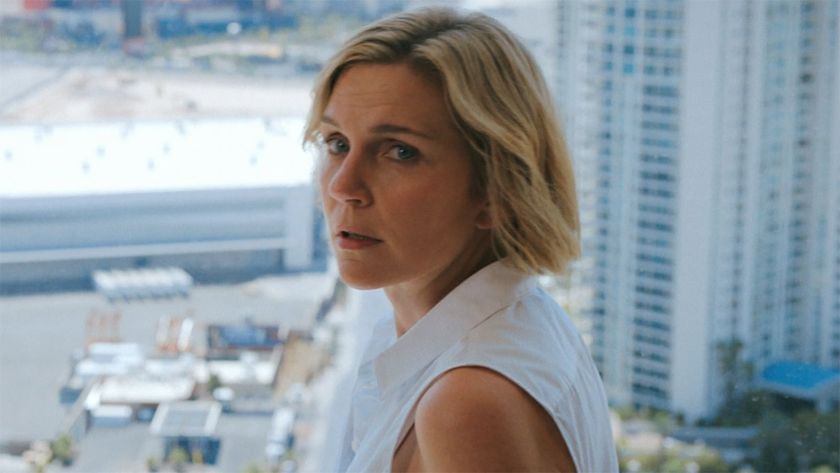 Carol looking back at an off-camera Koumba in Pluribus episode 6