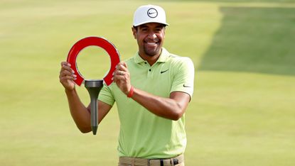 Tony Finau with the trophy after his win in the 2022 Rocket Mortgage Classic