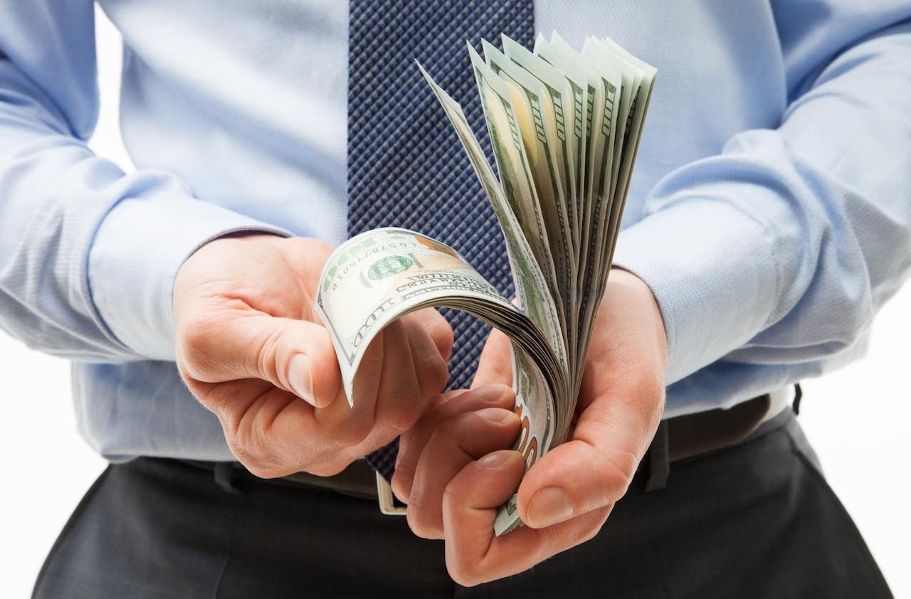 Man&amp;#039;s hands holding dollar banknotes, closeup shot