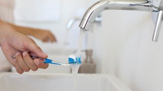 woman brushing teeth