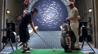 Jack O'Neill (Richard Dean Anderson) lines up for a tee shot to P4X-239, a distance of several billion miles