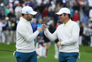 Branden Grace and Louis Oosthuizen fist bump at the Presidents Cup