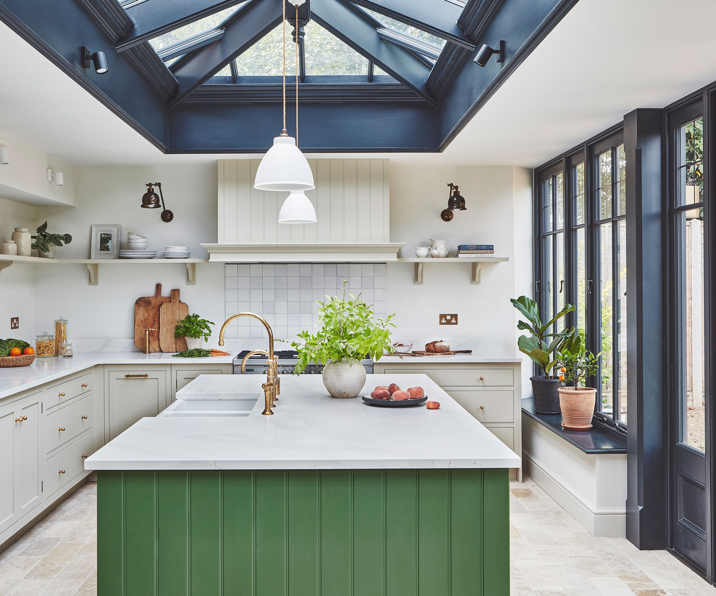 white orangery kitchen with green kitchen island