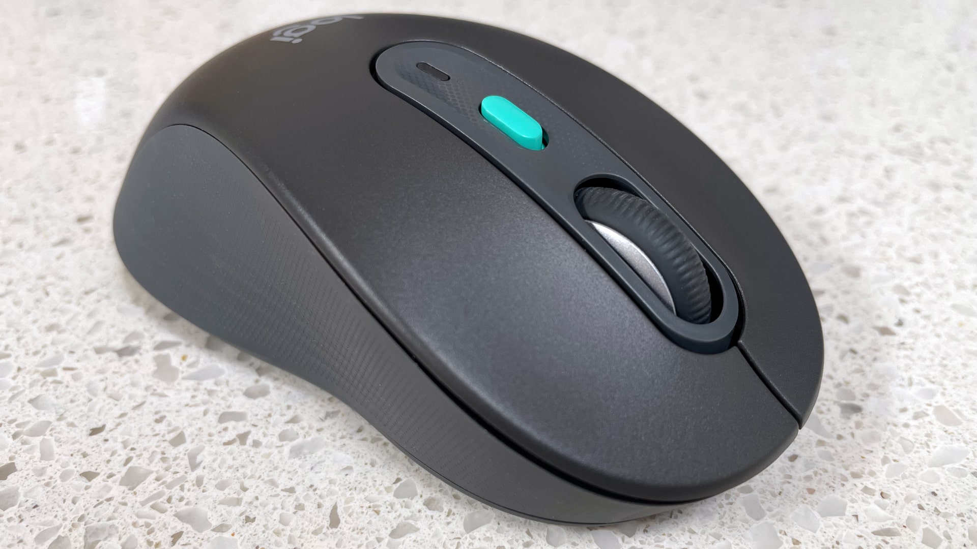 The Logitech Signature AI Edition M750 mouse on a worktop.