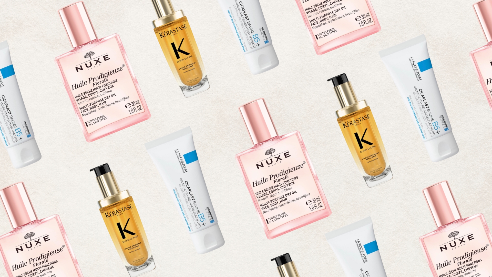 A roundup of French beauty products from La Roche-Posay, NUXE and Kérastase arranged in a diagonal pattern and on a white textured background