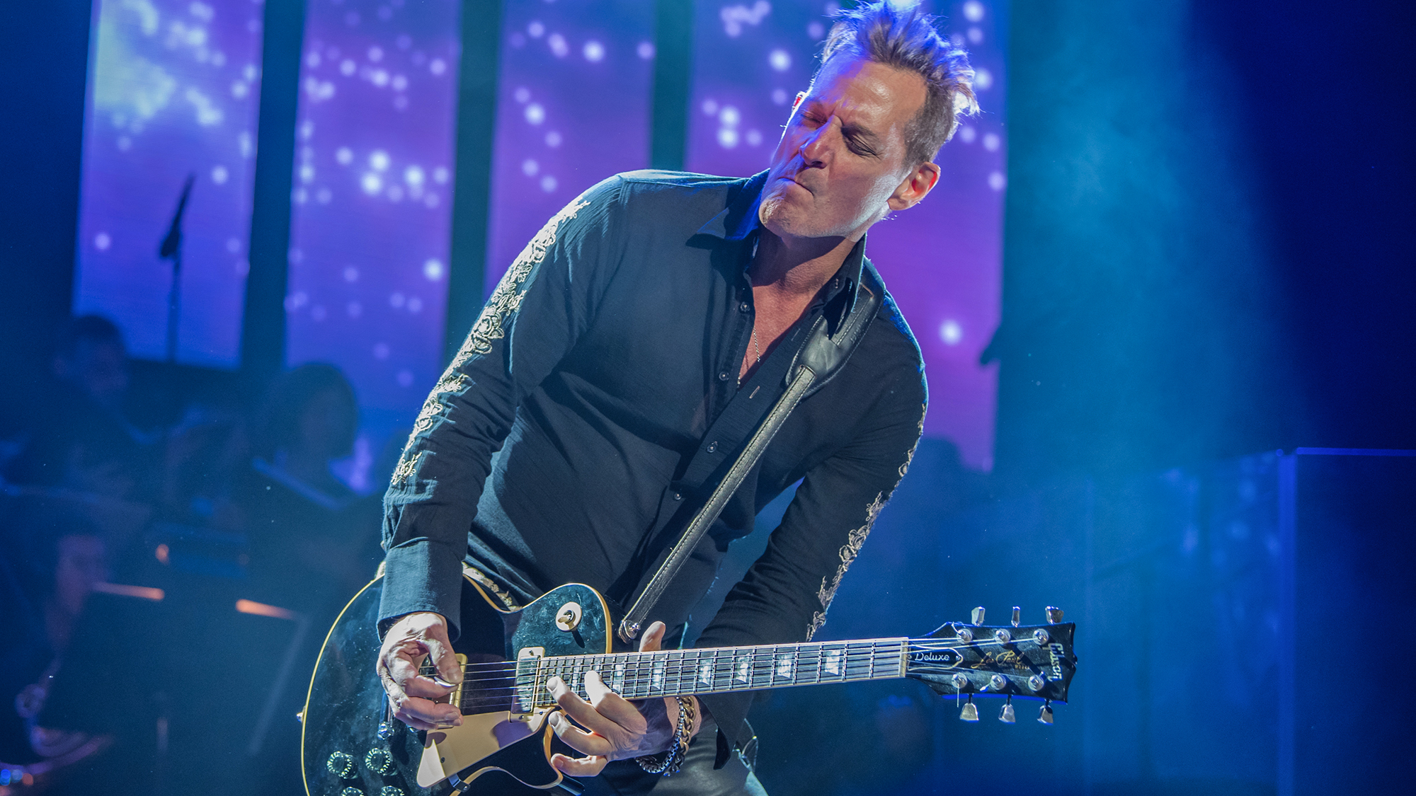 Guitarist Tony Bruno performs onstage