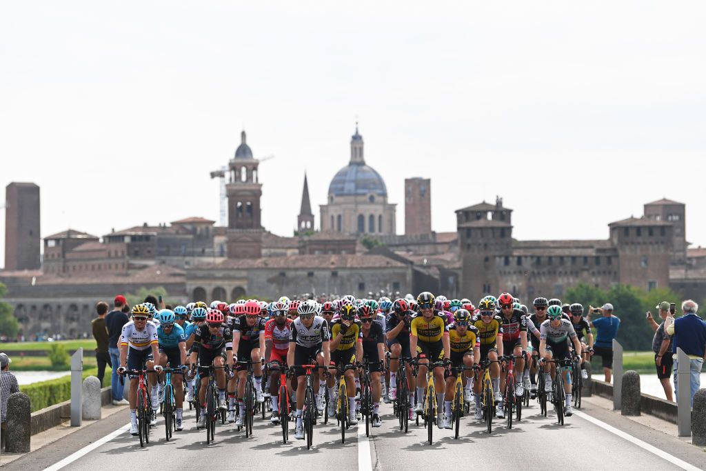 VERONA ITALY MAY 21 Luis Leon Sanchez Gil of Spain Aleksander Vlasov of Russia and Team Astana Premier Tech White Best Young Rider Jersey Tejay Van Garderen of United States and Team EF Education Nippo Egan Arley Bernal Gomez of Colombia and Team INEOS Grenadiers Pink Leader Jersey Max Walscheid of Germany and Team Qhubeka Assos Edoardo Affini of Italy and Team Jumbo Visma The Peloton passing through Mantova City during the 104th Giro dItalia 2021 Stage 13 a 198km stage from Ravenna to Verona Landscape Castle Church girodiitalia Giro UCIworldtour on May 21 2021 in Verona Italy Photo by Tim de WaeleGetty Images