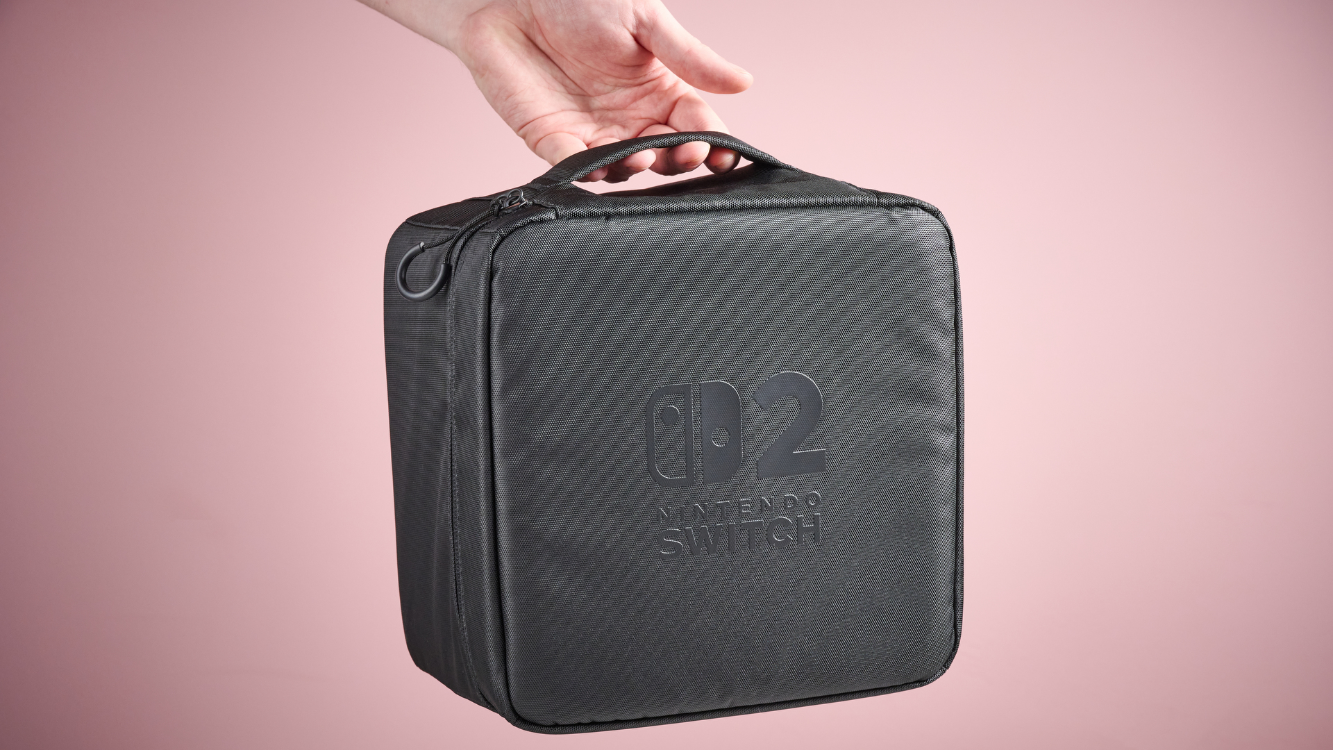Person holding the Nintendo Switch 2 All-In-One Carrying Case