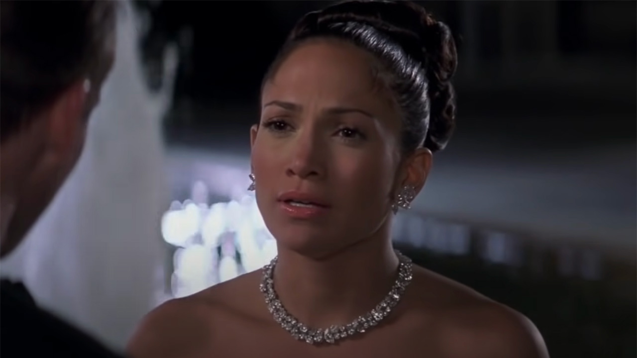 Jennifer Lopez in peach gown and borrowed jewelry in Maid in Manhattan.