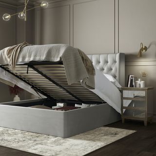 grey bed up with storage underneath