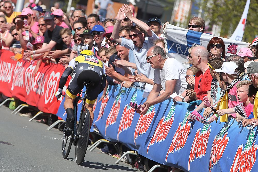 Fans cheer as a rider from the Dutch Lotto-NL-Jumbo team passes by