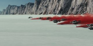 Speeders kicking up red ash on Crait