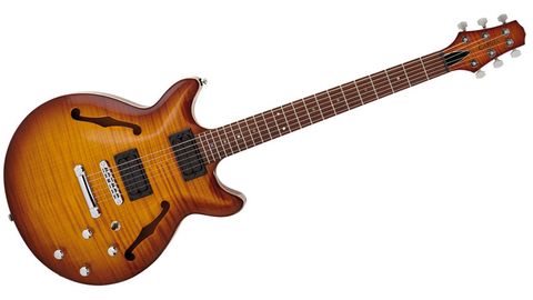 It's certainly well finished with a dark brown 'burst to the maple top - with PRS-like natural maple edge