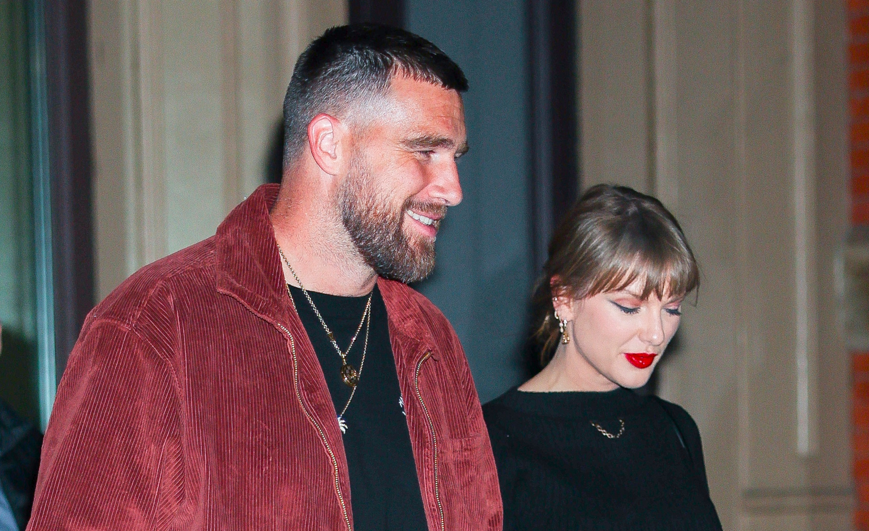Taylor Swift in a black outfit and Travis Kelce in a red jacket and black T-shirt in NoHo on November 06, 2025 in New York City
