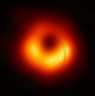 Swirling golden gas and dust shows polarized magnetic fields around the supermassive black hole at the heart of M87, as seen in a composite image obtained by the Event Horizon Telescope in 2021.