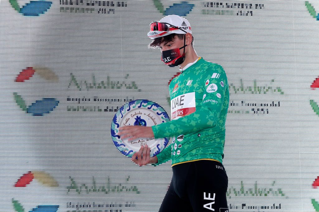 OTURA SPAIN FEBRUARY 18 Alessandro Covi of Italy and UAE Team Emirates celebrates at podium as green points jersey winner after the 68th Vuelta A Andalucia Ruta Del Sol 2022 Stage 3 a 1532km stage from Lucena to Otura 68RdS on February 18 2022 in Otura Spain Photo by Bas CzerwinskiGetty Images