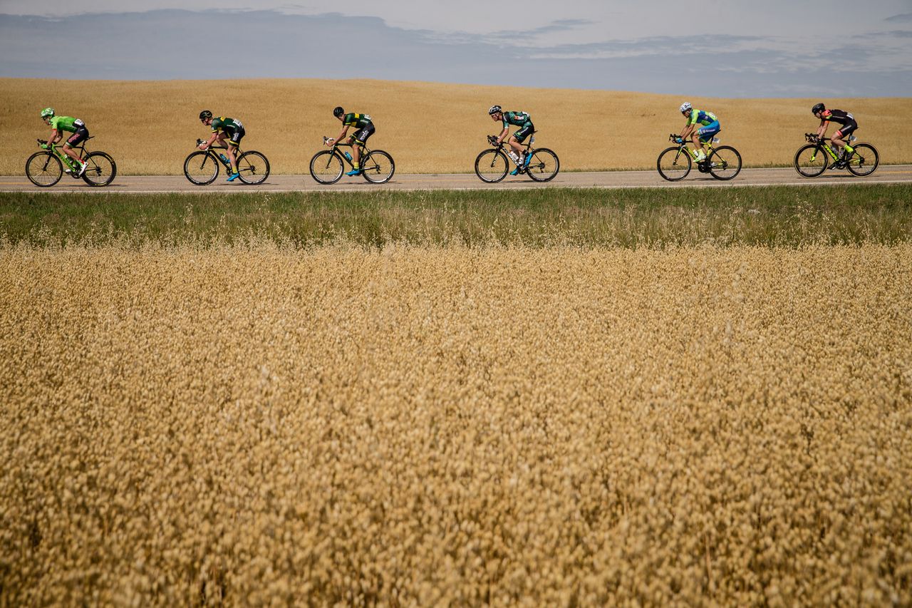 The peloton rides through the plains of Alberta during stage 2