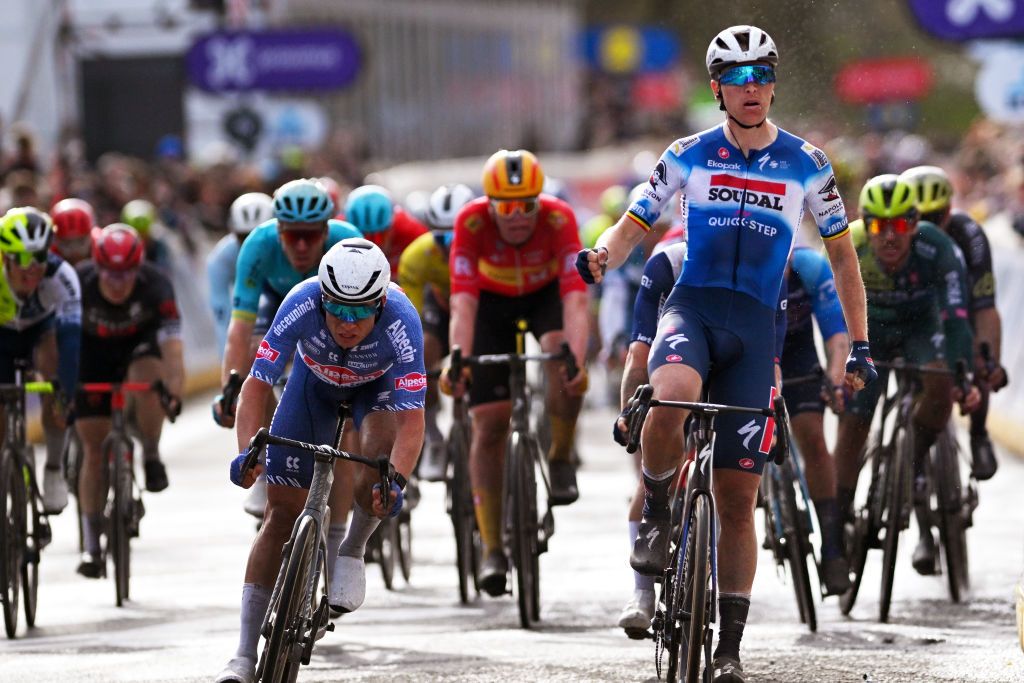 SCHOTEN BELGIUM APRIL 03 Tim Merlier of Belgium and Team Soudal QuickStep R celebrates at finish line as race winner ahead of Jasper Philipsen of Belgium and Team Alpecin Deceuninck L during the 112th Scheldeprijs 2024 Mens Elite a 2053km one day race from Terneuzen to Schoten on April 03 2024 in Schoten Belgium Photo by Luc ClaessenGetty Images