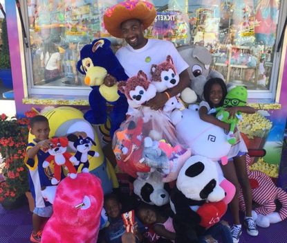 Gilbert Arenas, his children, and all of their new stuffed animals.