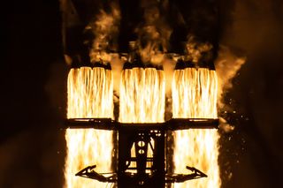 SpaceX's Falcon Heavy rocket fires its engines for a spectacular nighttime liftoff from NASA's historic launch pad 39A at Kennedy Space Center in Florida.